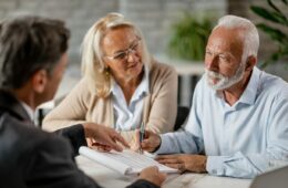 Staffords Wealth Management photo explaining to a couple about Estate Planning Strategies and how it helps you to provide for the future of your loved ones and ensures your assets are preserved for future generations, according to your wishes.